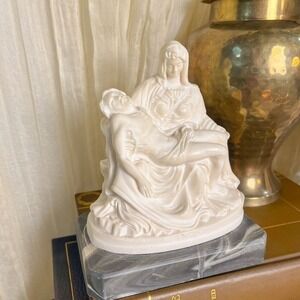 Alabaster Pieta statue on a marble base